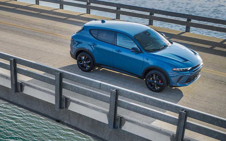 A Dodge Hornet driving over a bridge